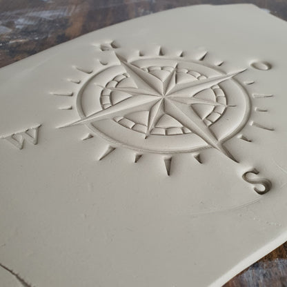 Stamp plate compass wind rose